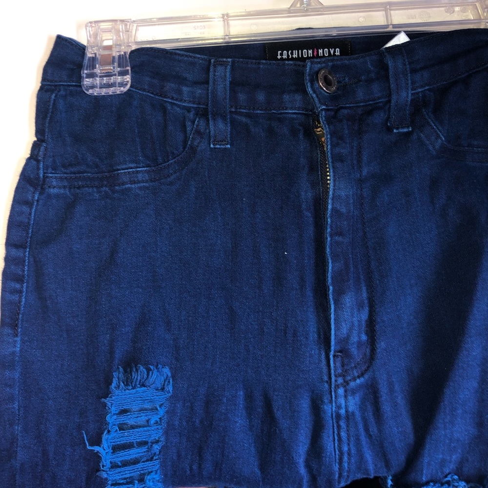 High-waisted distressed blue jeans